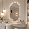 Arched LED vanity mirror with digital clock display and illuminated touch control icons above a dressing table.